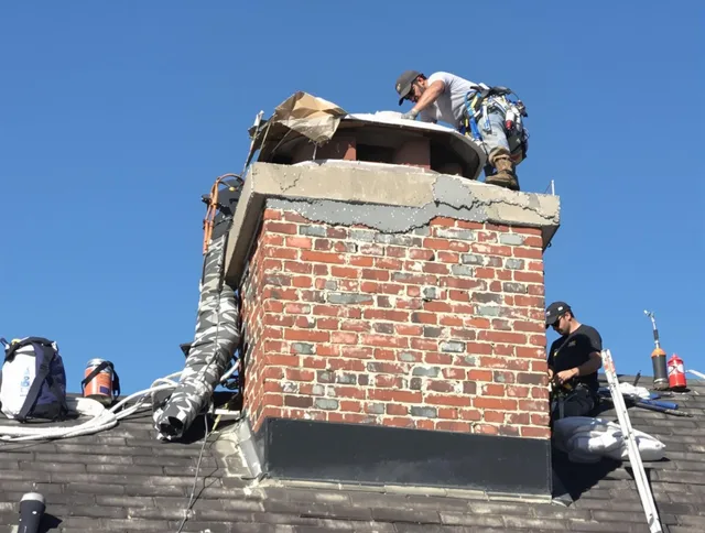 Corona Chimney Sweep installing a custom chimney crown in Corona, CA