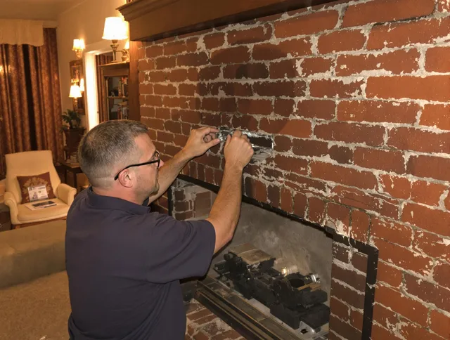 Corona Chimney Sweep expert fixing a fireplace in Corona, CA